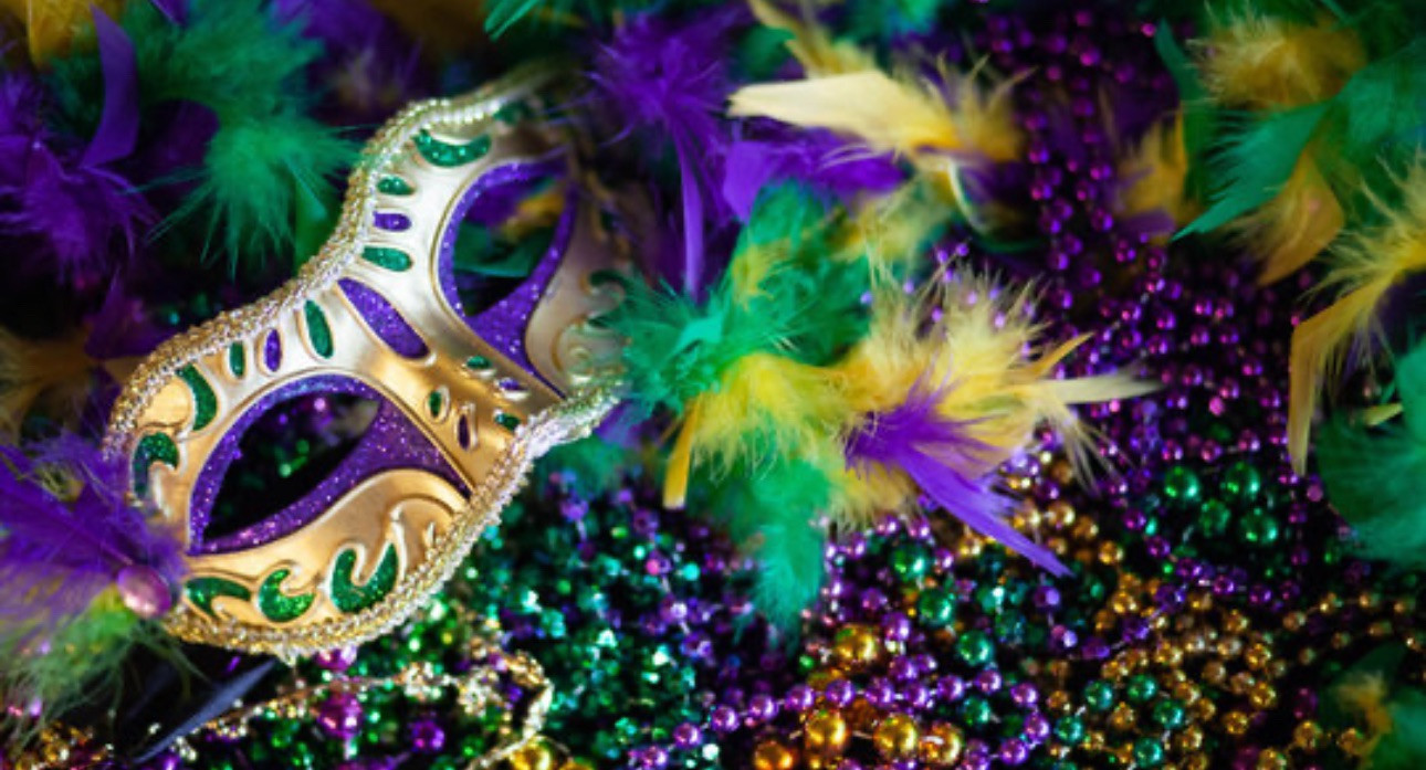 Mardi Gras mask, beads, and feathers.