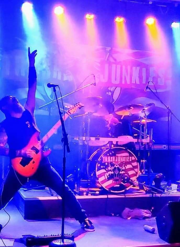 Photo of Trash Junkies band at a concert.